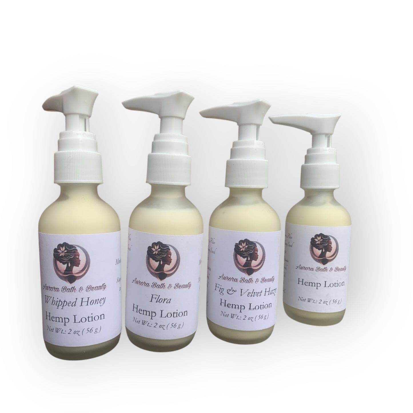 Four bottles of hemp lotion with labels on a white background