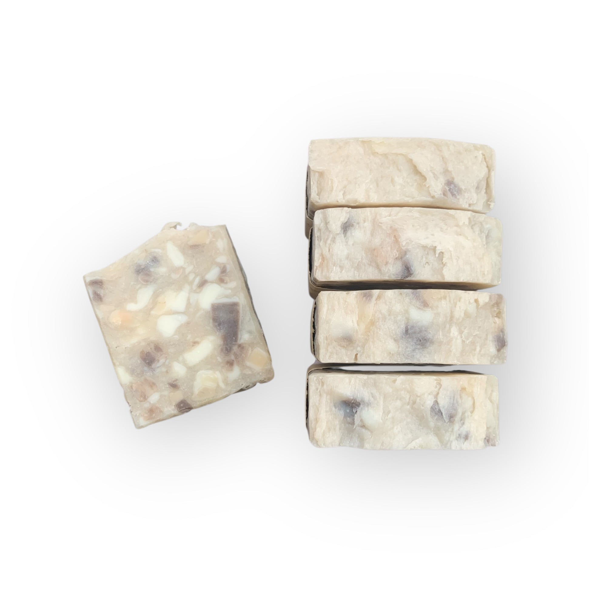 Five bars of soap with a marbled pattern on a white background