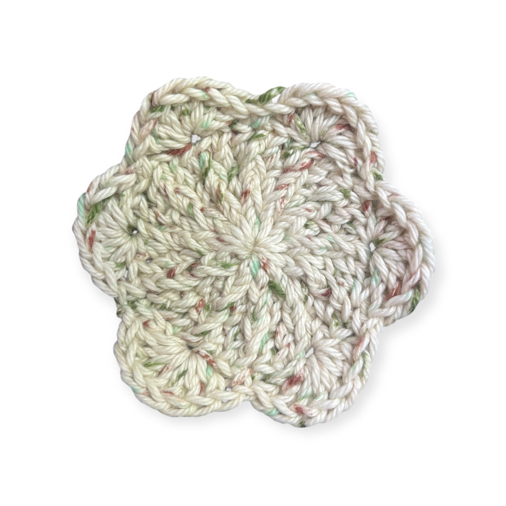 Beige and natural tones crocheted cloth on a white background