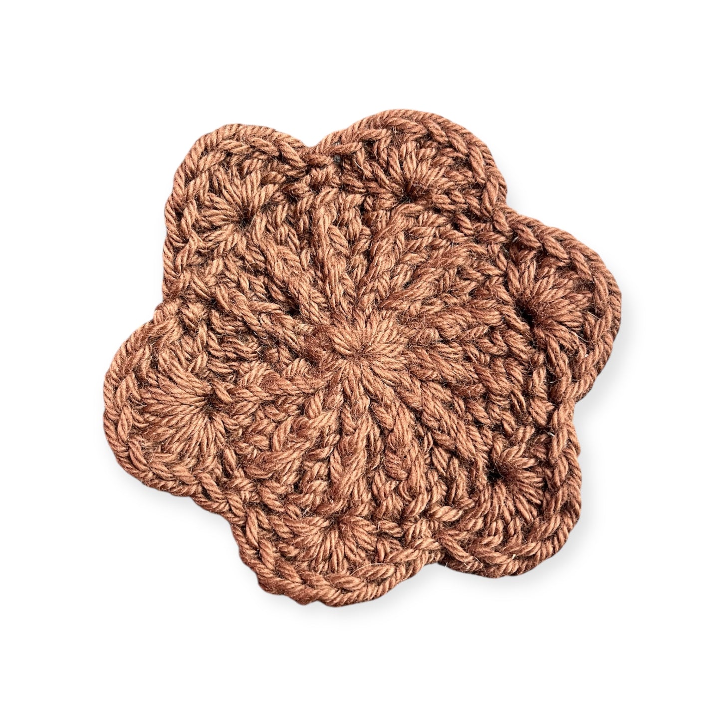Brown crocheted cloth on a white background