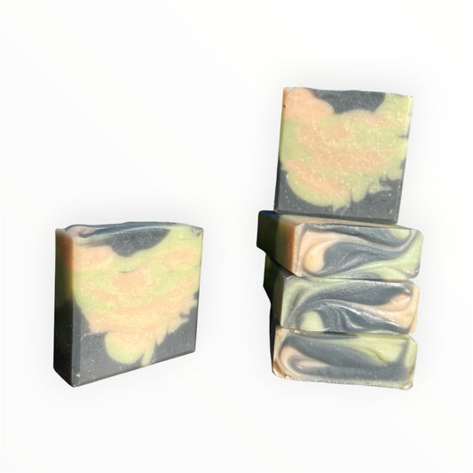 Five soap bars with a marbled design on a white background