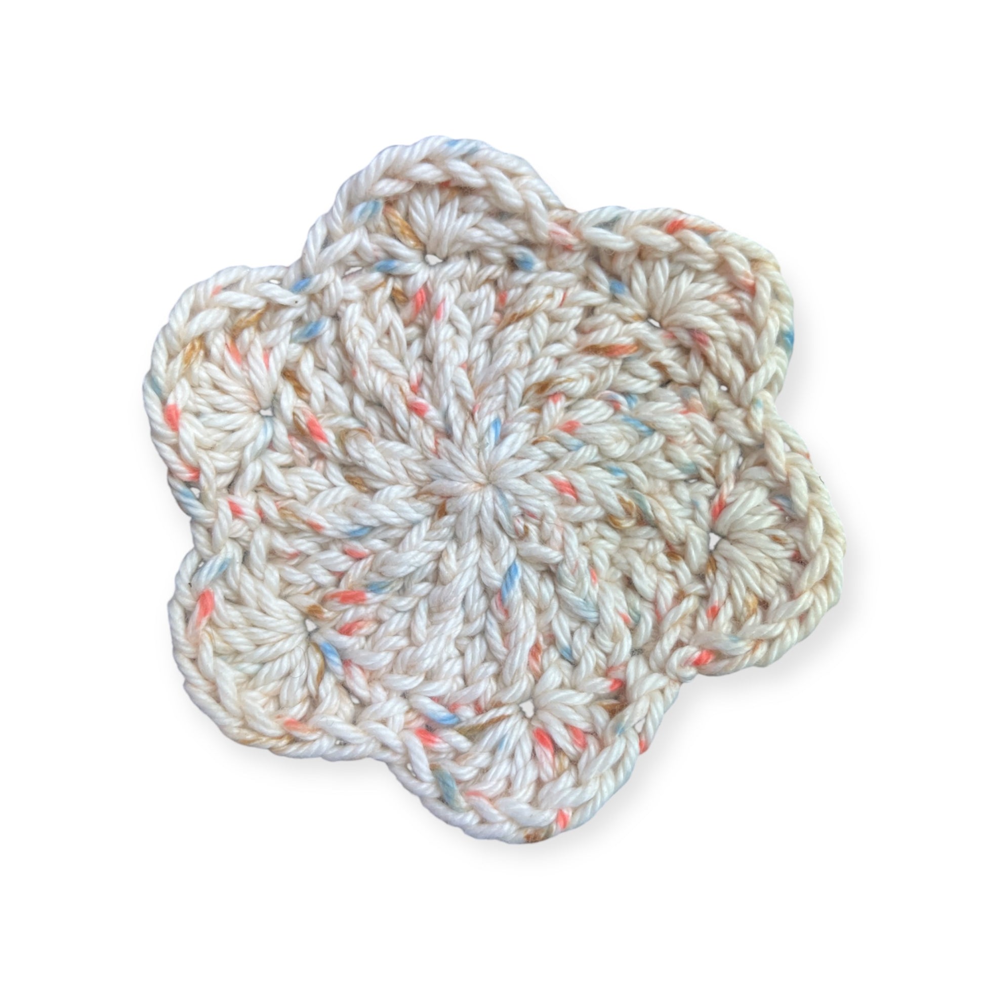 Light pink crocheted cloth on a white background