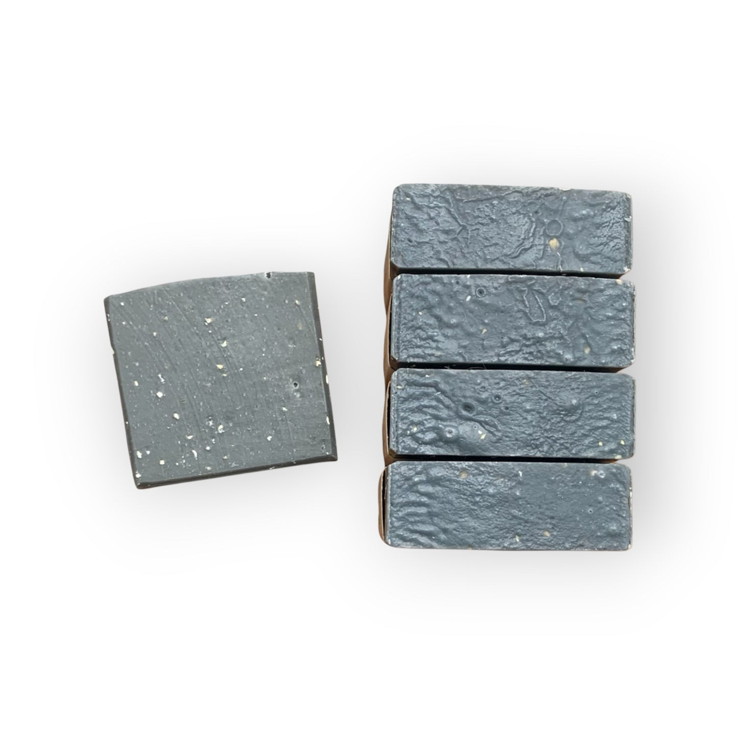 Set of five gray soap bars on a white background