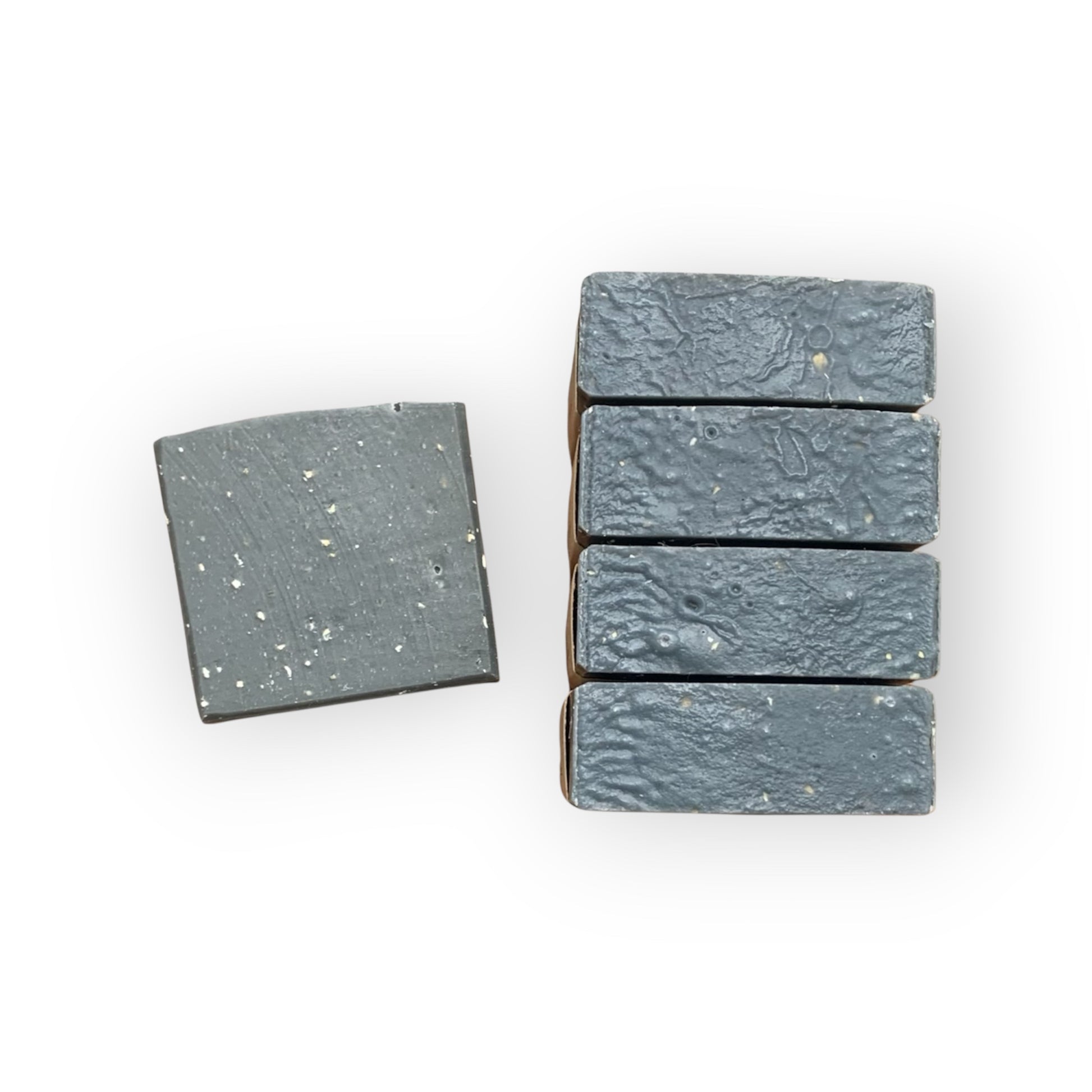 Set of five gray soap bars on a white background