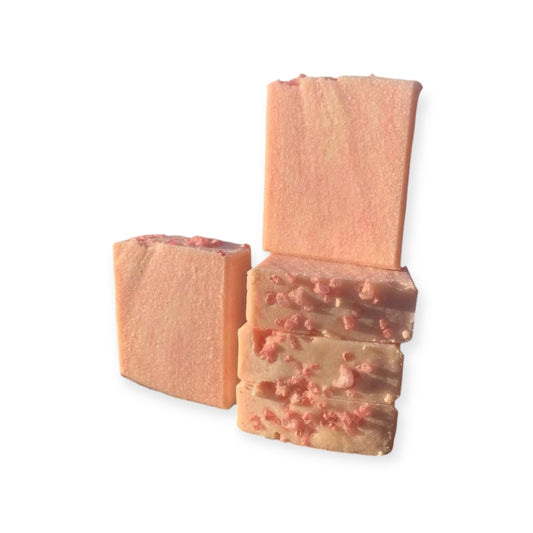 Pink marbled soap bars on a white backgrounde