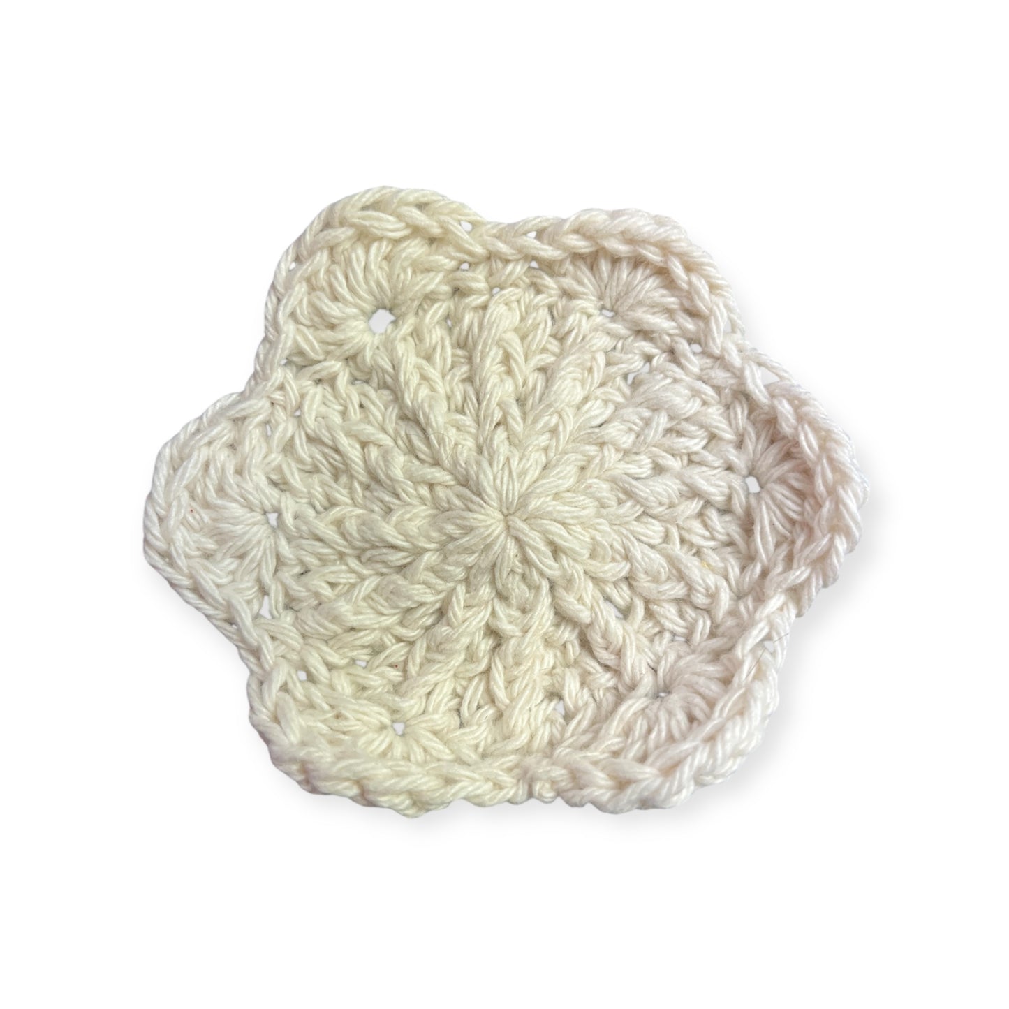 White crocheted cloth on a white background
