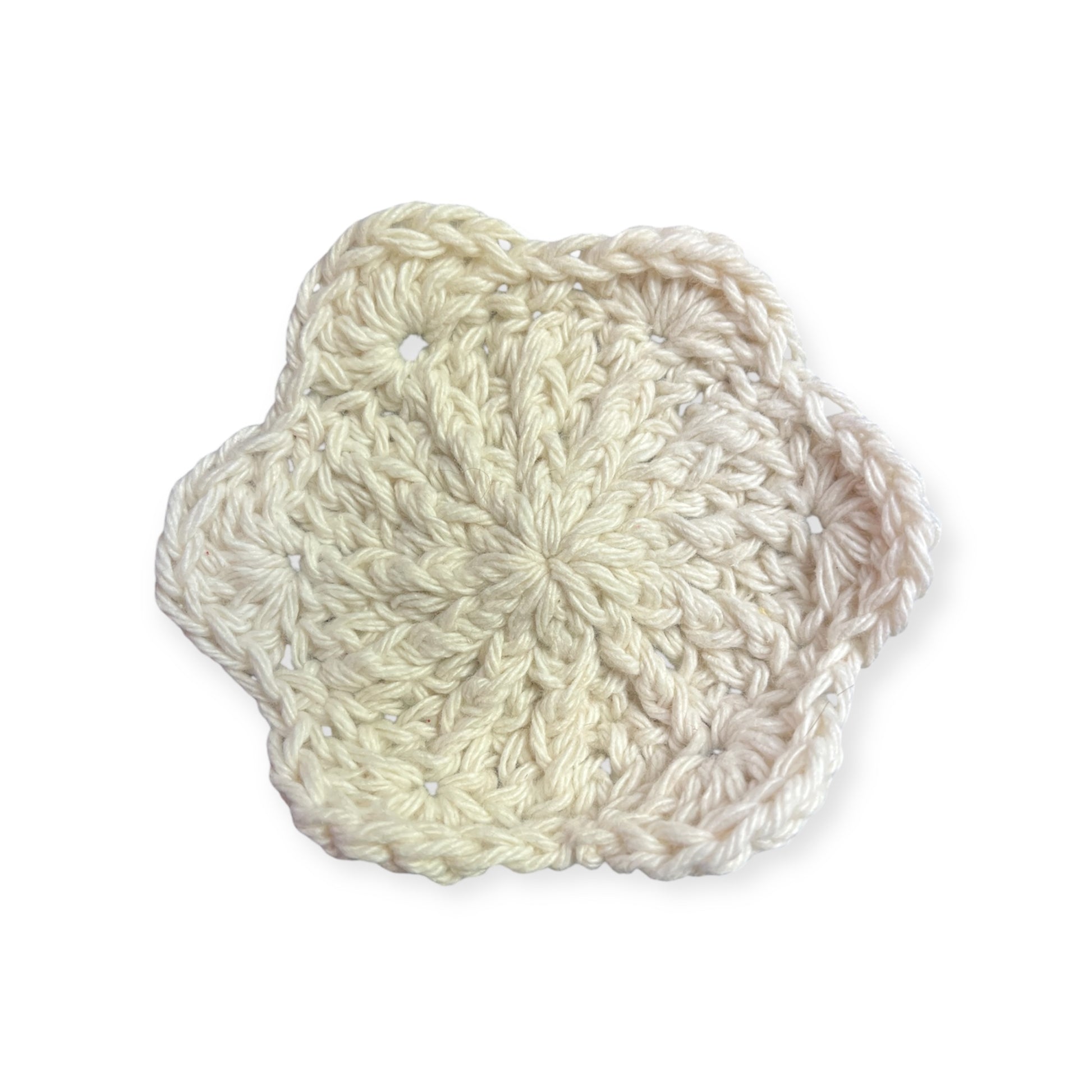 White crocheted cloth on a white background