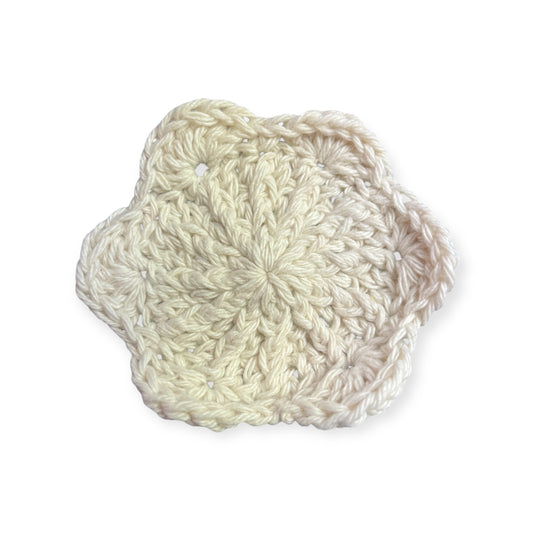 White crocheted cloth on a white background